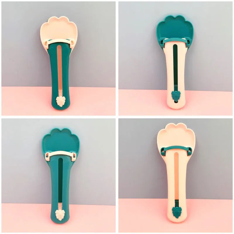 Green and pink pet food squeezer feeder scoop for cats and dogs.
