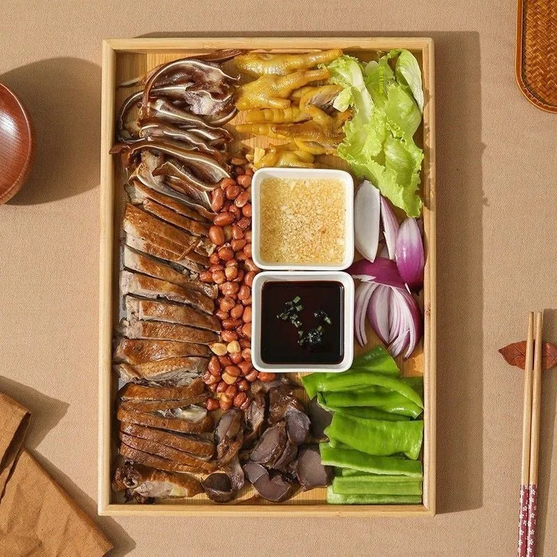 Brown handled bamboo square serving tray on a table