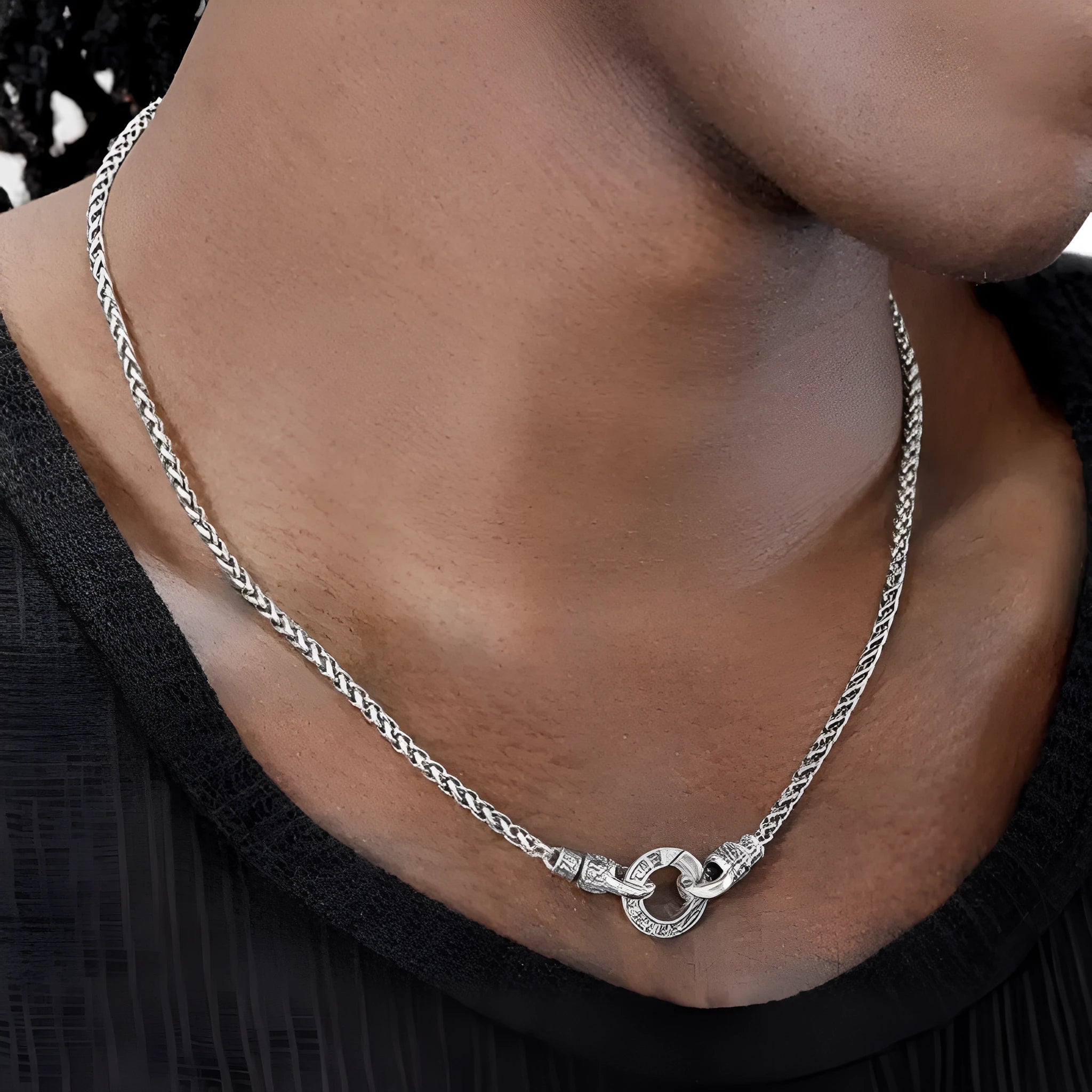 Polished S925 sterling silver necklace with a small pendant on a fine chain, shown at clavicle length.