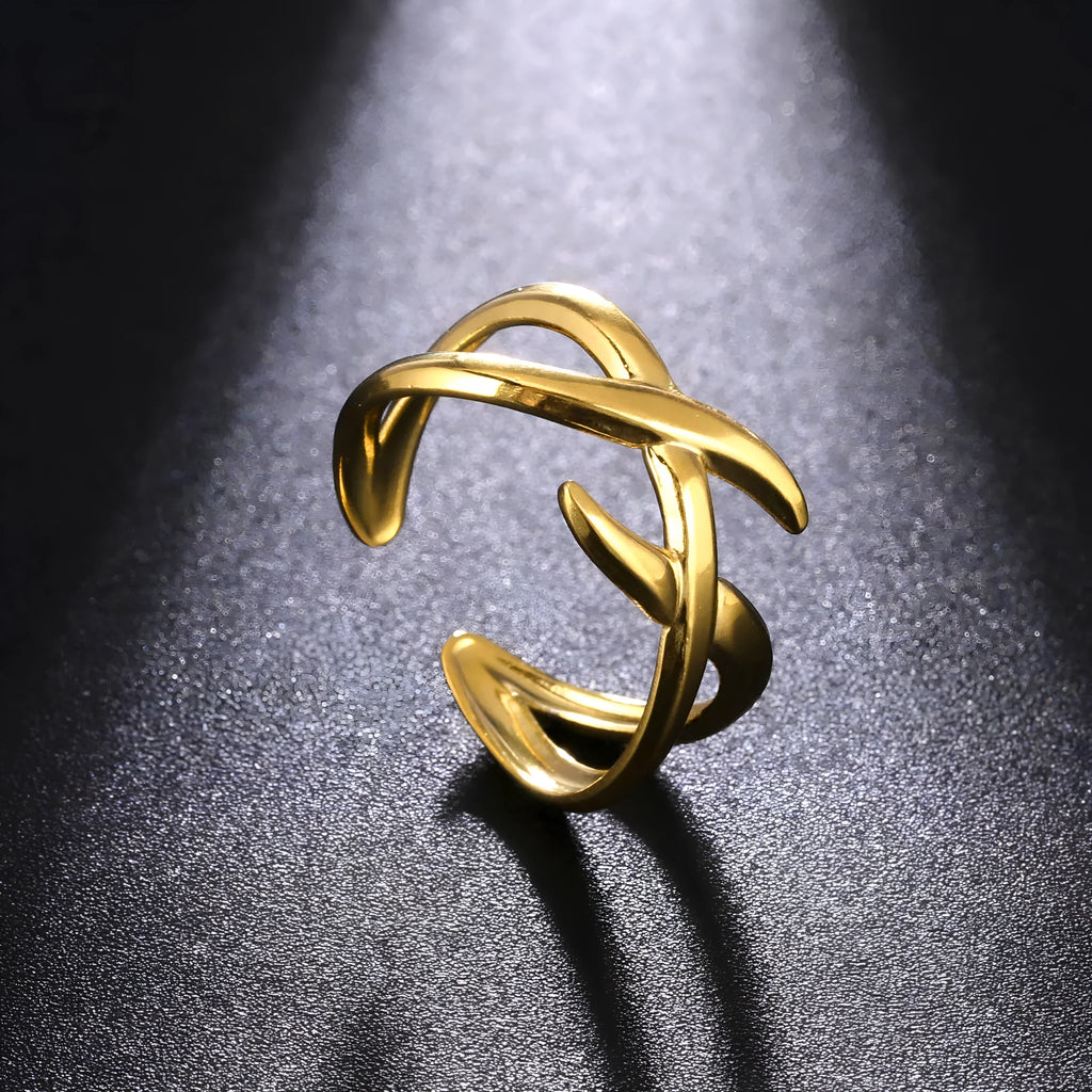 Retro women's stainless steel open ring in gold colour with adjustable opening on white background