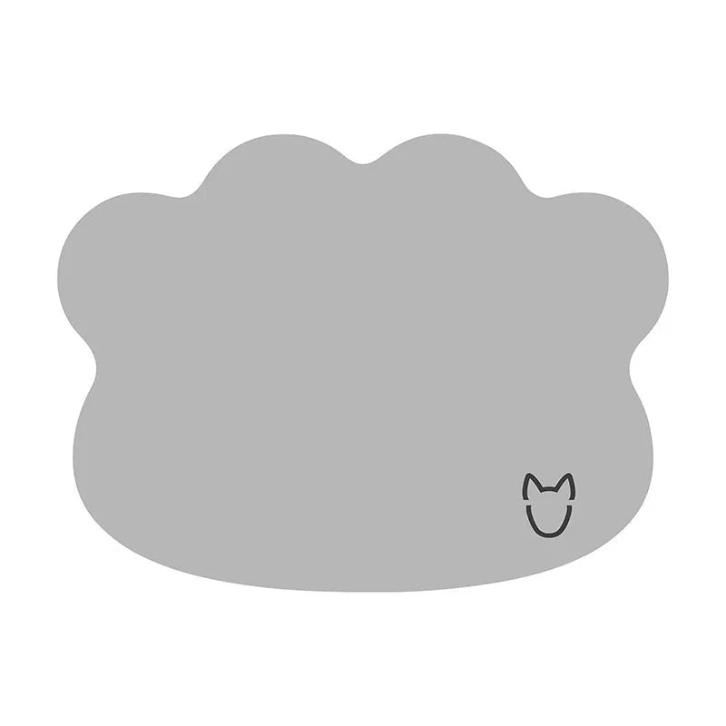 Ice silk dog cooling mat with dog head shaped design in light grey on a wooden floor.