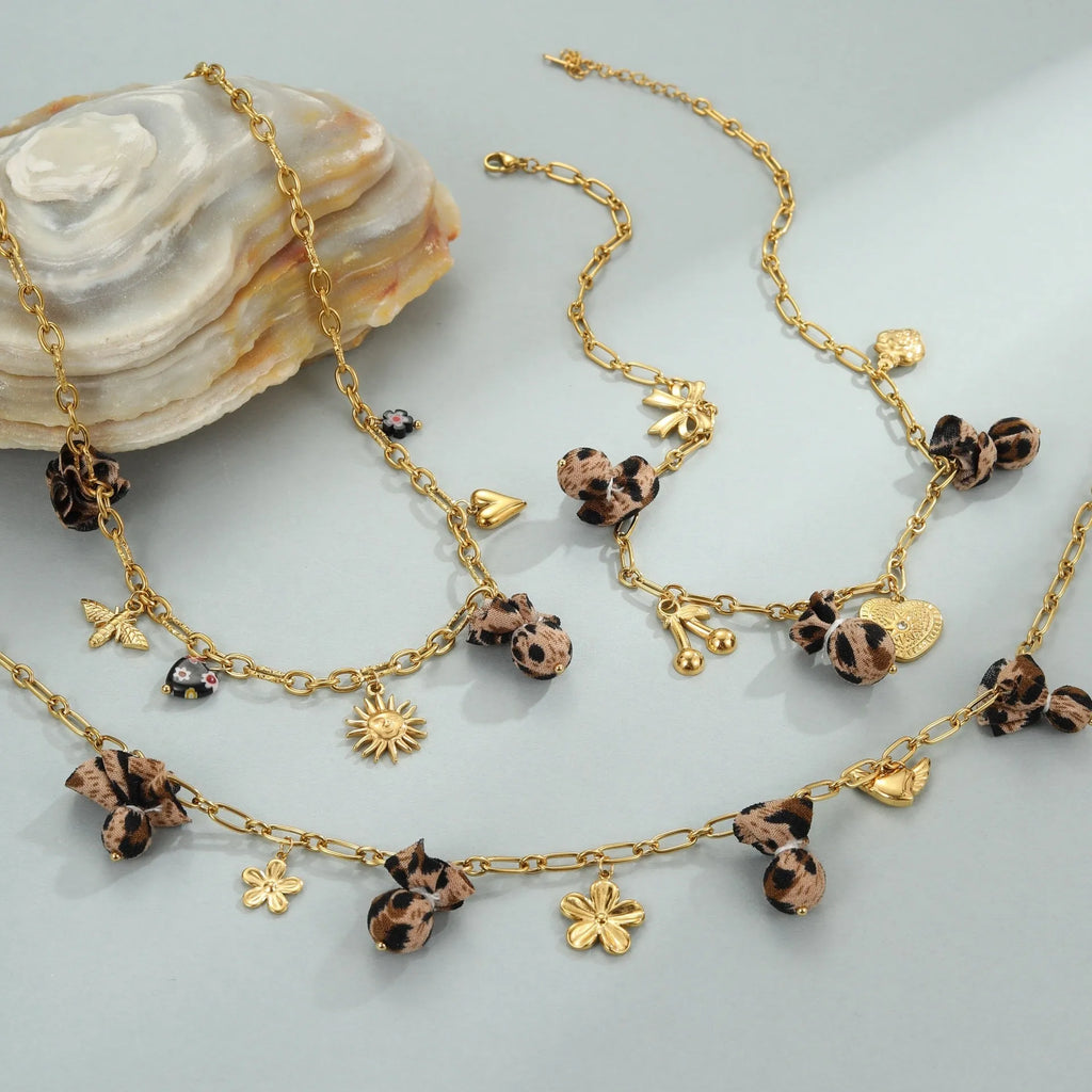 Stainless steel necklace with leopard, love hearts and flowers pendant on adjustable chain