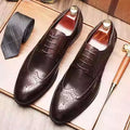 Men's burgundy pointed toe brogue shoes with carved patterns and low heel