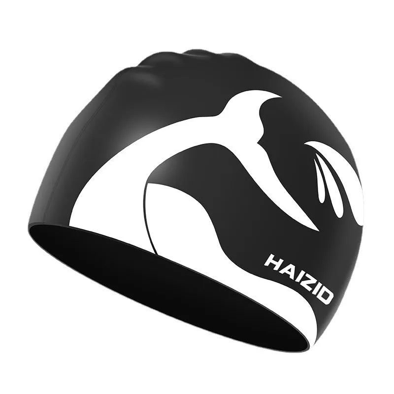 Silicone swim cap with whale tail pattern and moulded ear protectors in a choice of colours.