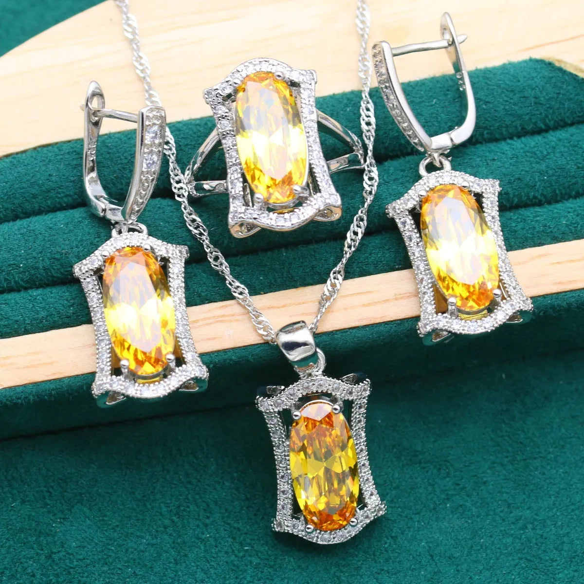 Women's anti-allergy zircon jewellery set with snake bone chain necklace, earrings, ring, and bracelet in yellow gold tone.