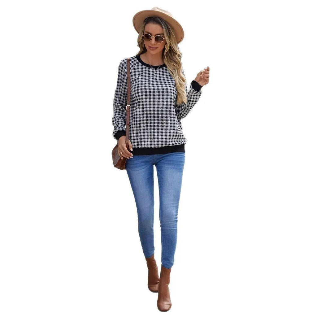 Black long sleeve pullover sweater with printed plaid and stripe pattern design.