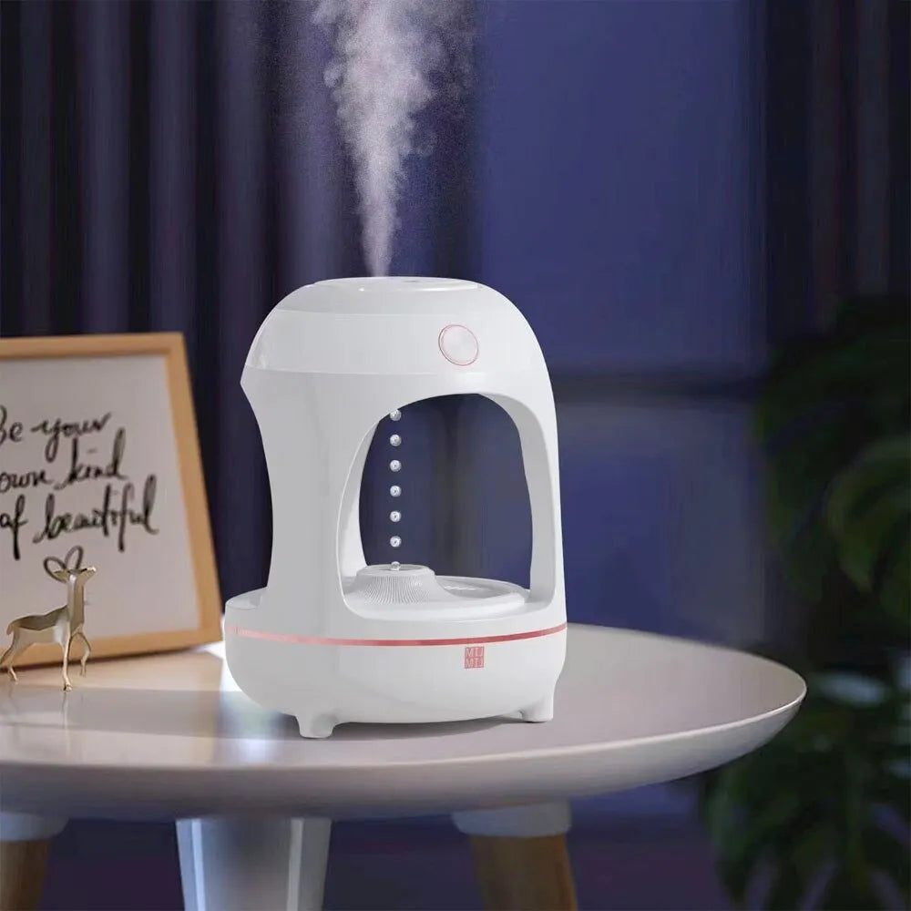 Anti gravity levitating water drops ultrasonic humidifier with LED night light in rose gold and white colour on a desk