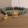 Natural emerald jade bracelet for women with abacus beads and a safety lock clasp on a white background.