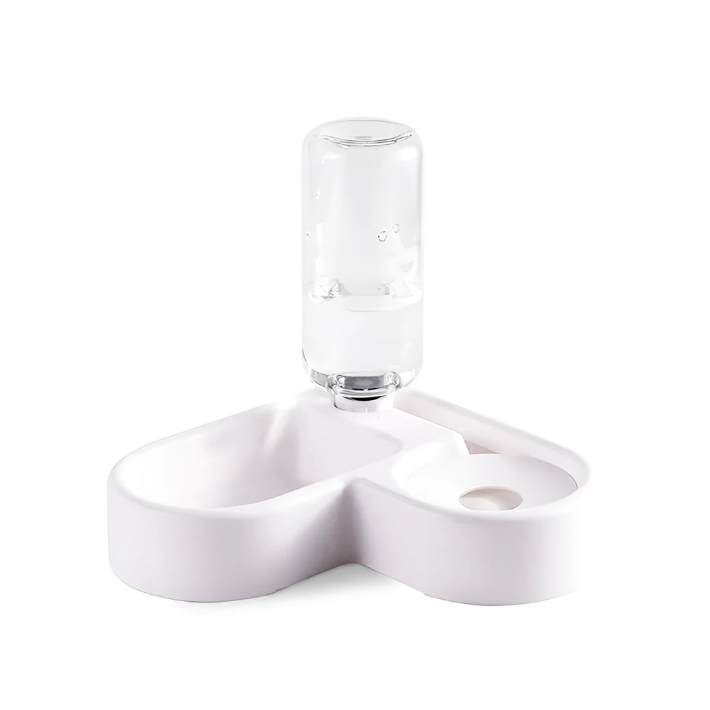 White pet water fountain for cats and dogs indoors on a kitchen floor.