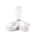 White pet water fountain for cats and dogs indoors on a kitchen floor.