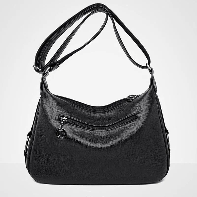 Blue women's large shoulder bag with crossbody strap showing internal mobile phone and certificate pockets