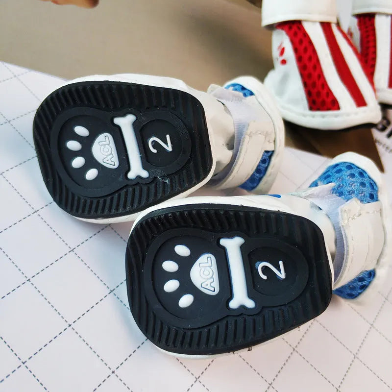 Blue, pink, and red cloth dog shoes with zippers, shown as a set of four for small breed pets.