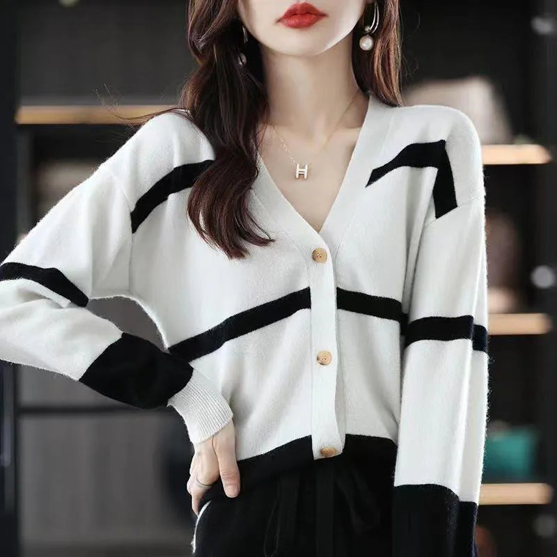 Women's slim-fit V-neck cardigan with 3D striped pattern and button front in assorted colours.