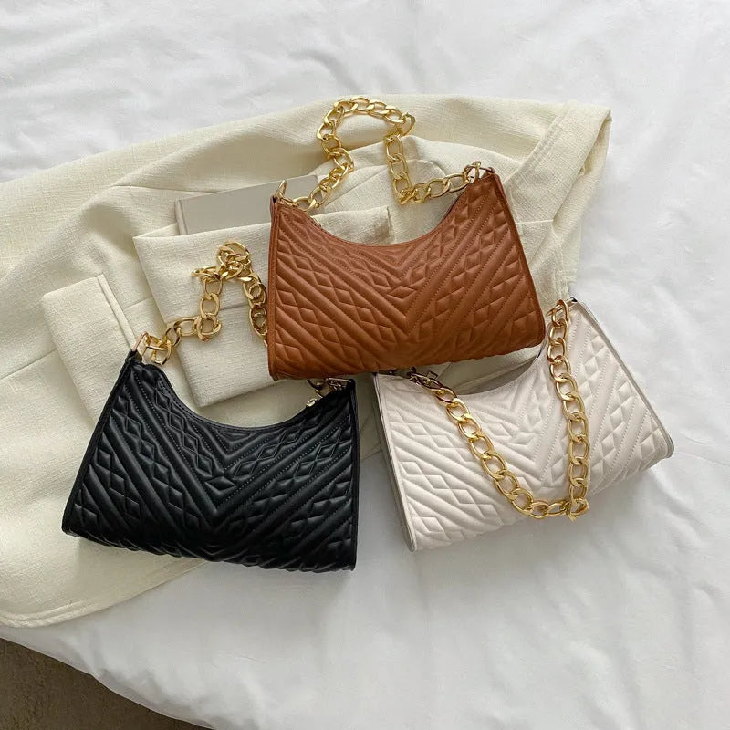 Brown pleated PU leather vertical square shoulder bag with a chain strap and soft handle.