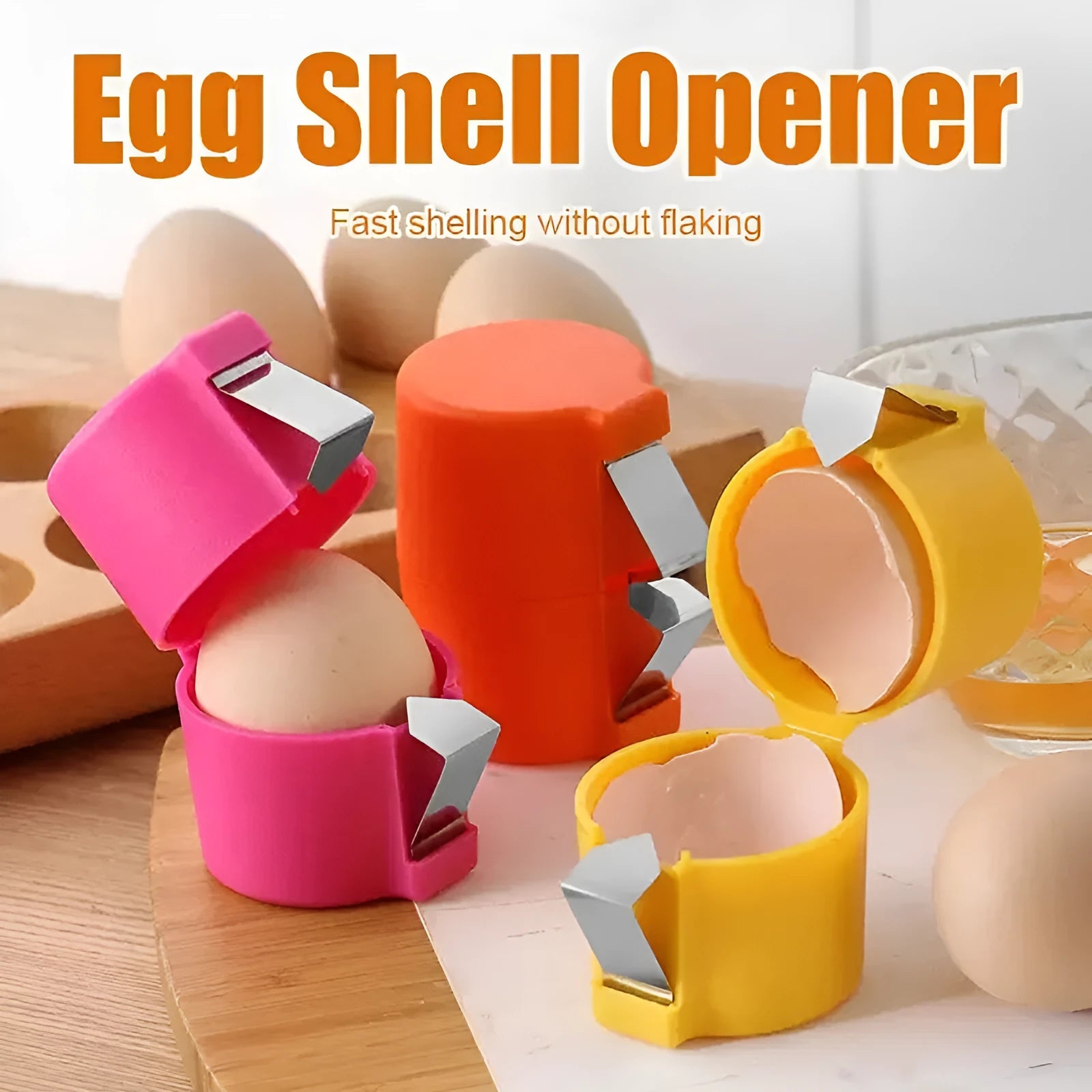 Egg shell opener and beater in pink with stainless steel mechanism on white background