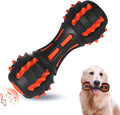 Red dumbbell-shaped rubber dog chew toy for medium and large breeds on a plain background.
