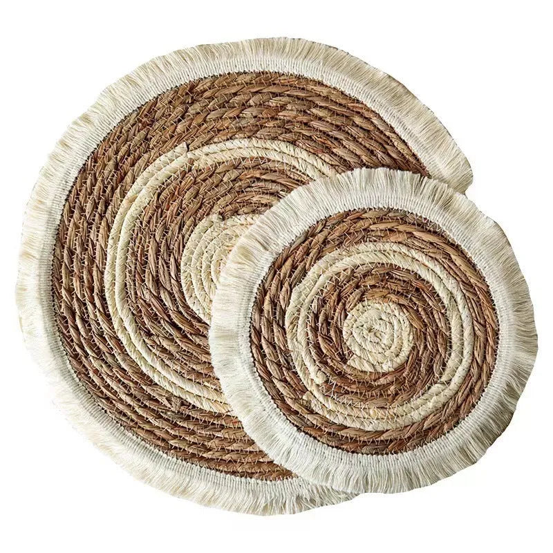 Round natural papyrus straw placemat with tassel detailing in 25cm, 30cm, 33cm, and 38cm sizes.