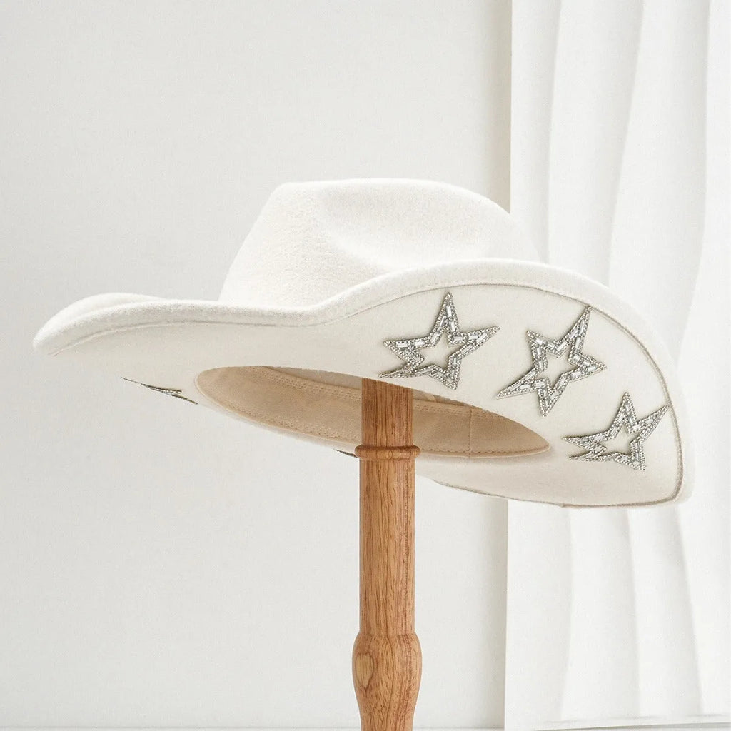 Denim top hat made from woolen felt with a conical crown and hexagonal star decoration.
