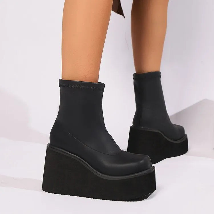 Plus size women's platform boots with wedge heel and round toe in black leather