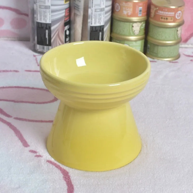 Ceramic anti-tumble pet bowl for dogs and cats with high foot and neck protector.