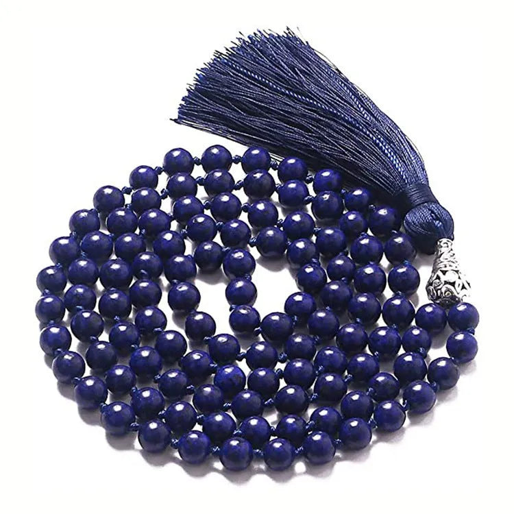 Long beaded agate and amethyst tassel necklace with blue grain stone and lapis lazuli on a geometric design.