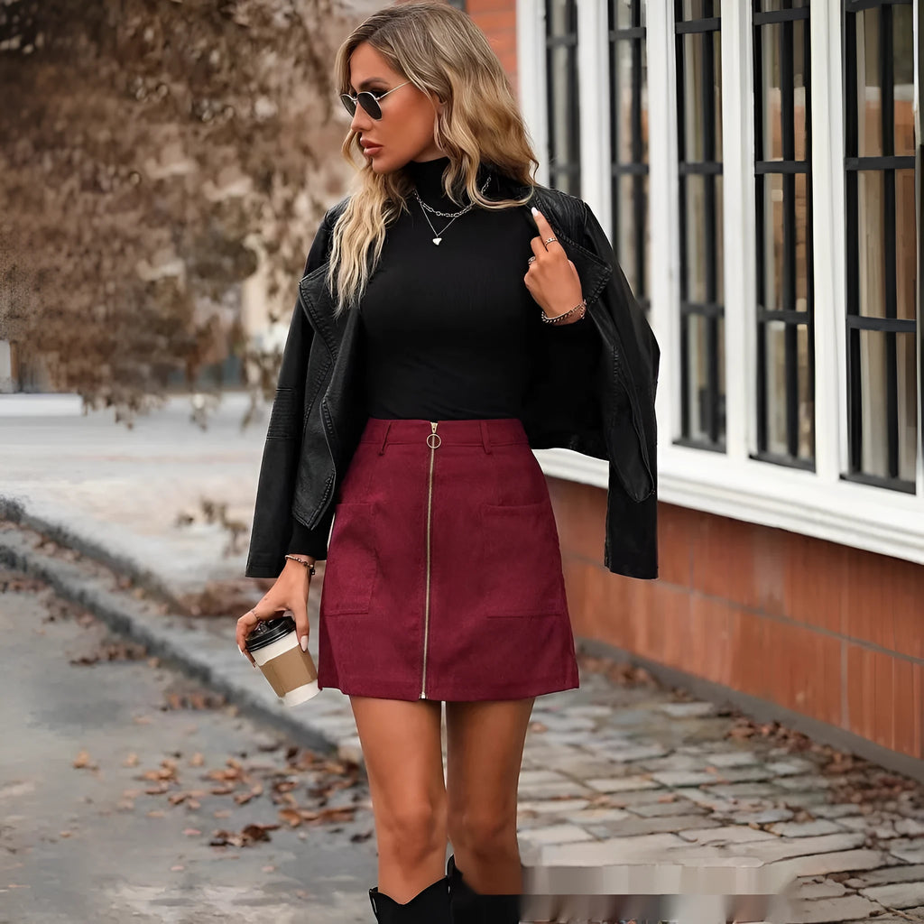Women's high waist short skirt with stitching and a zip detail in black polyester fabric
