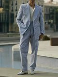 Women's blue and white striped polyester suit set with long-line blazer and matching trousers