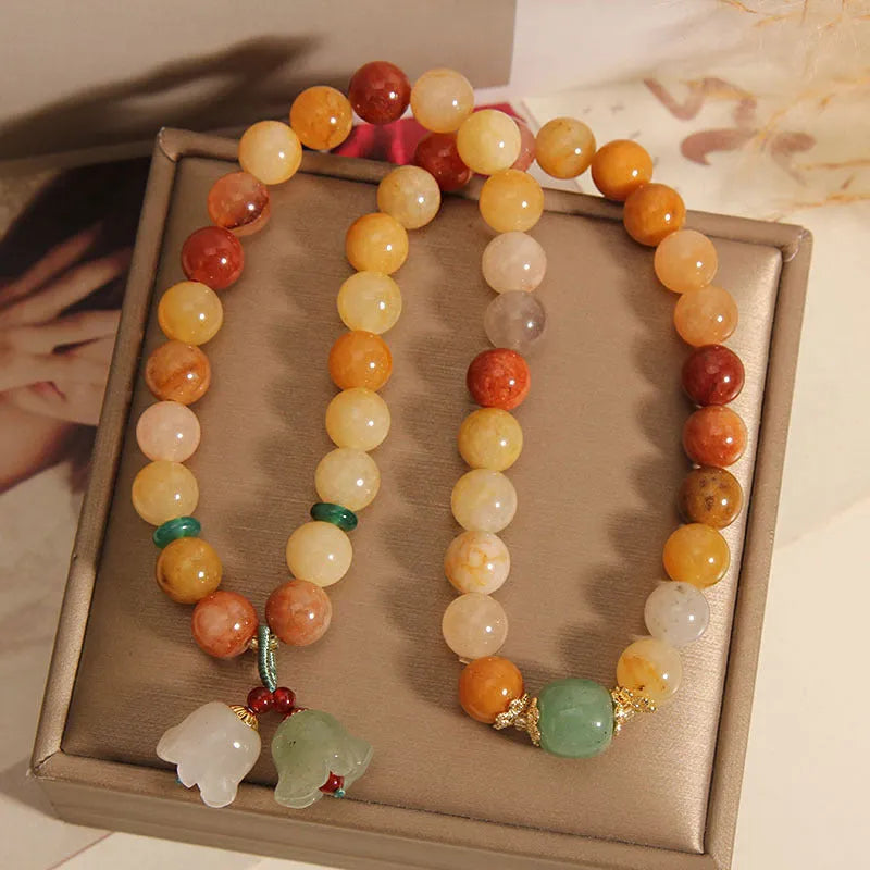 Natural Jinsi Jade multi-layer bracelet for women with orchid pendant colour option on plain background