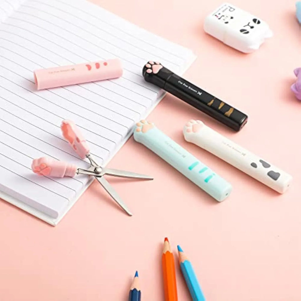 Cat paw mini folding craft scissors in four colours: black, blue, pink, and white, showing closed and open positions.