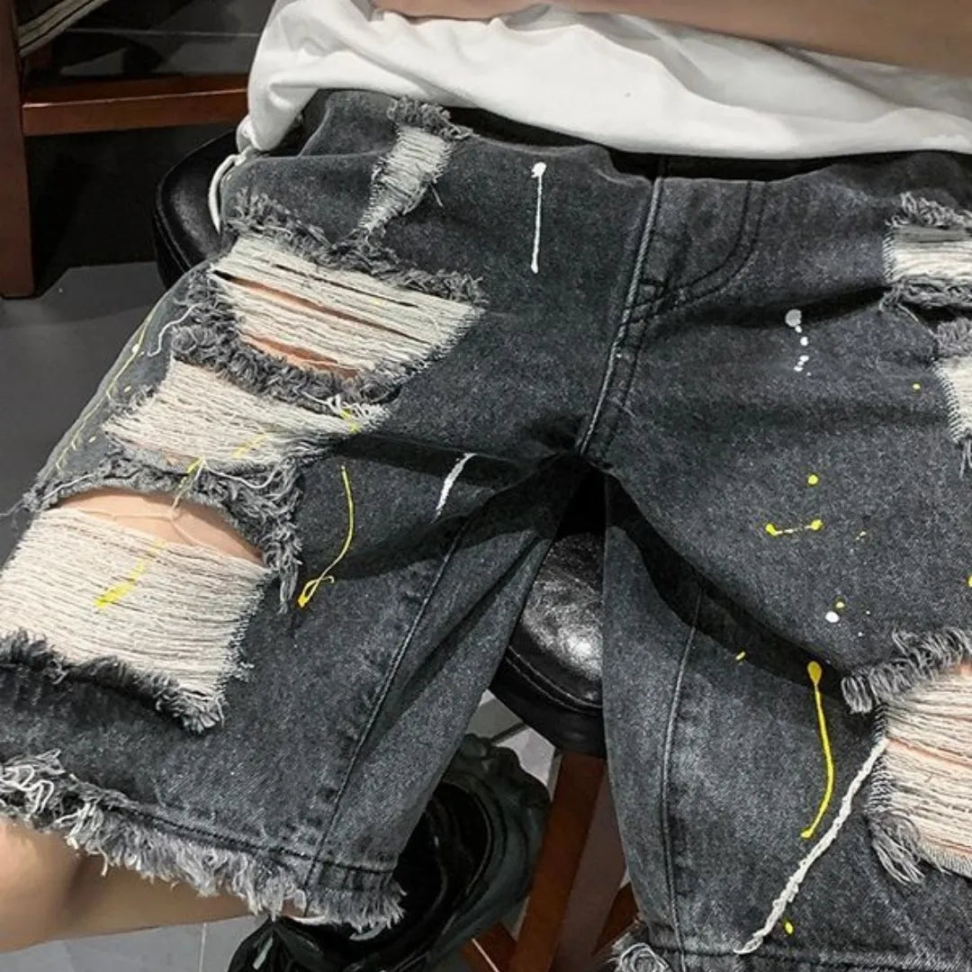 Men's loose-fit denim shorts with water washed hole detail in light blue colour.