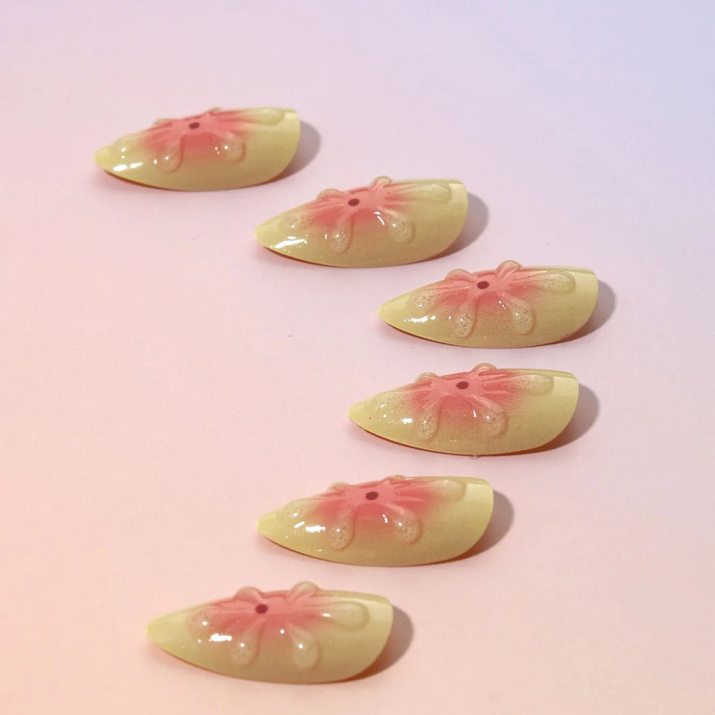 Set of detachable plastic fake nails with colourful 3D cartoon flower pattern, jelly glue pot, and filing strip.