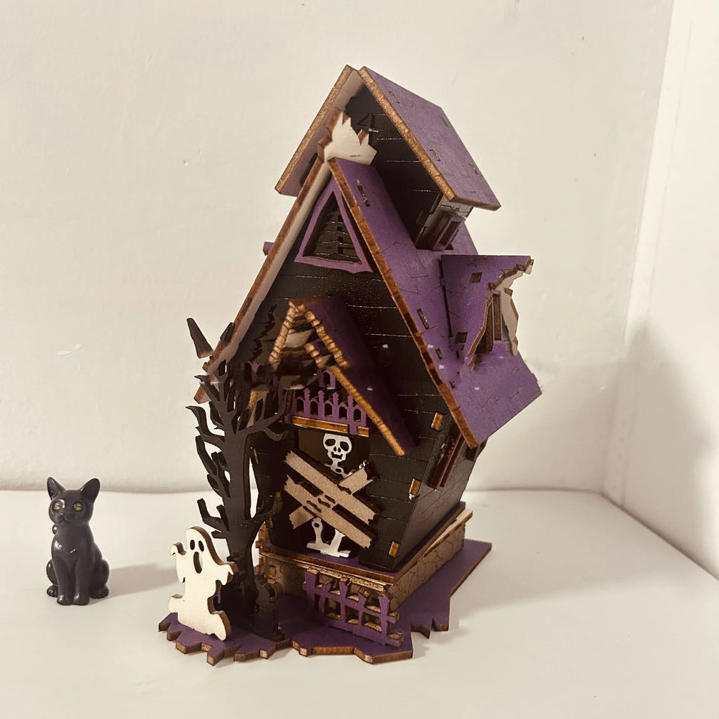 Unpainted wooden haunted house Halloween decoration measuring 14cm wide by 19cm tall