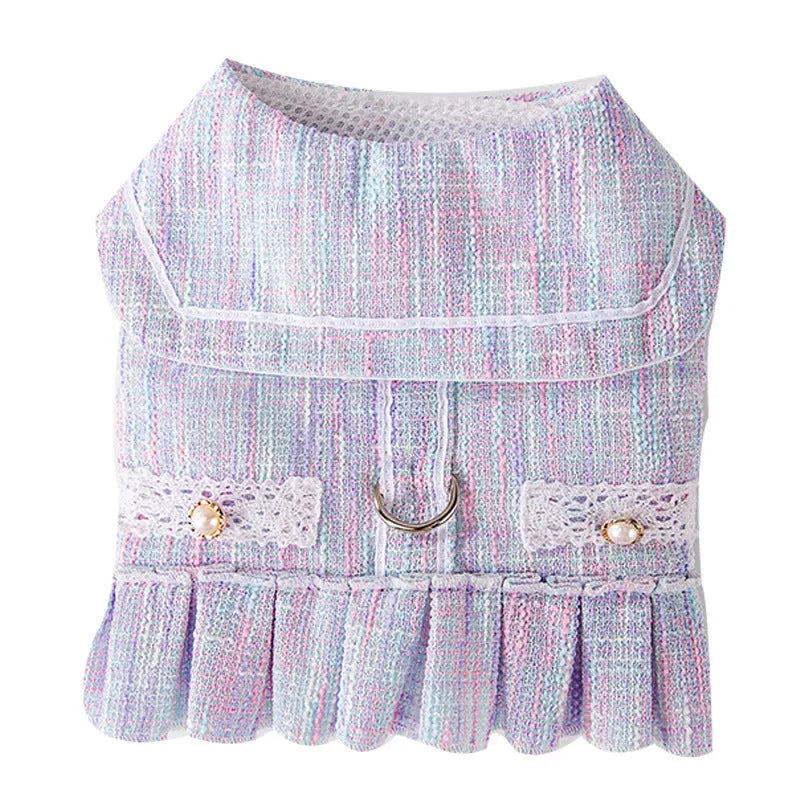 Purple hooded knitted sweater on a small dog, showing long sleeves and size label.
