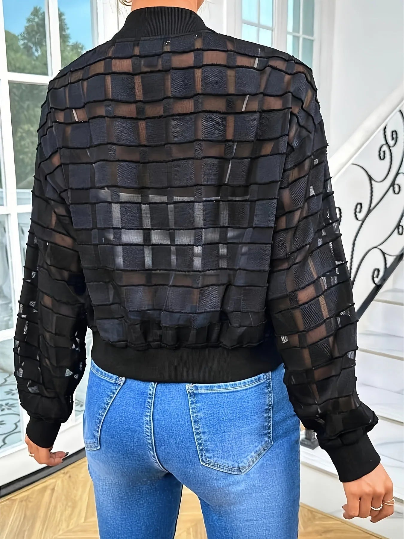 Black semi-transparent women's jacket with geometric pattern and front zipper