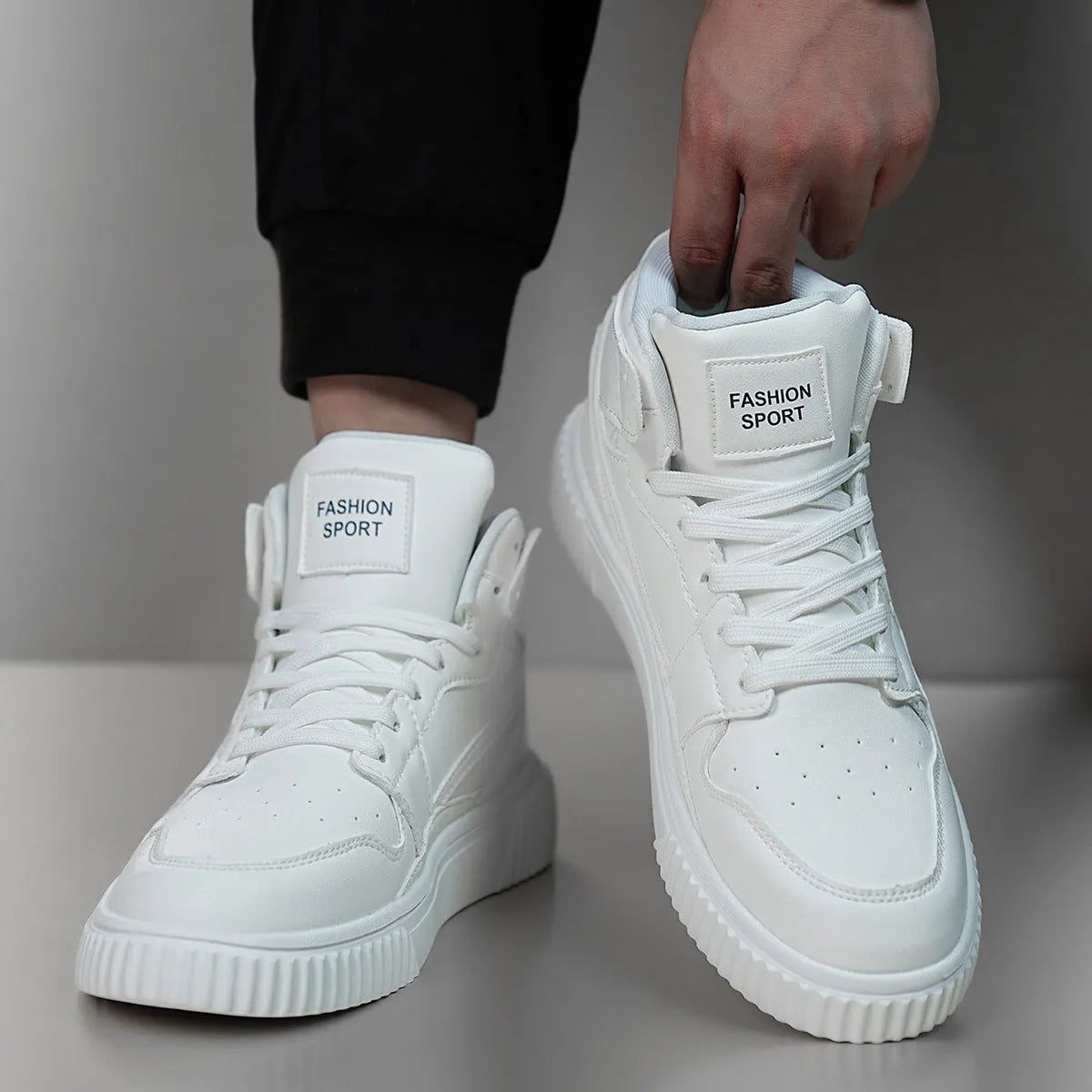 Men's solid white round toe casual shoes with a microfiber leather upper on a neutral background.