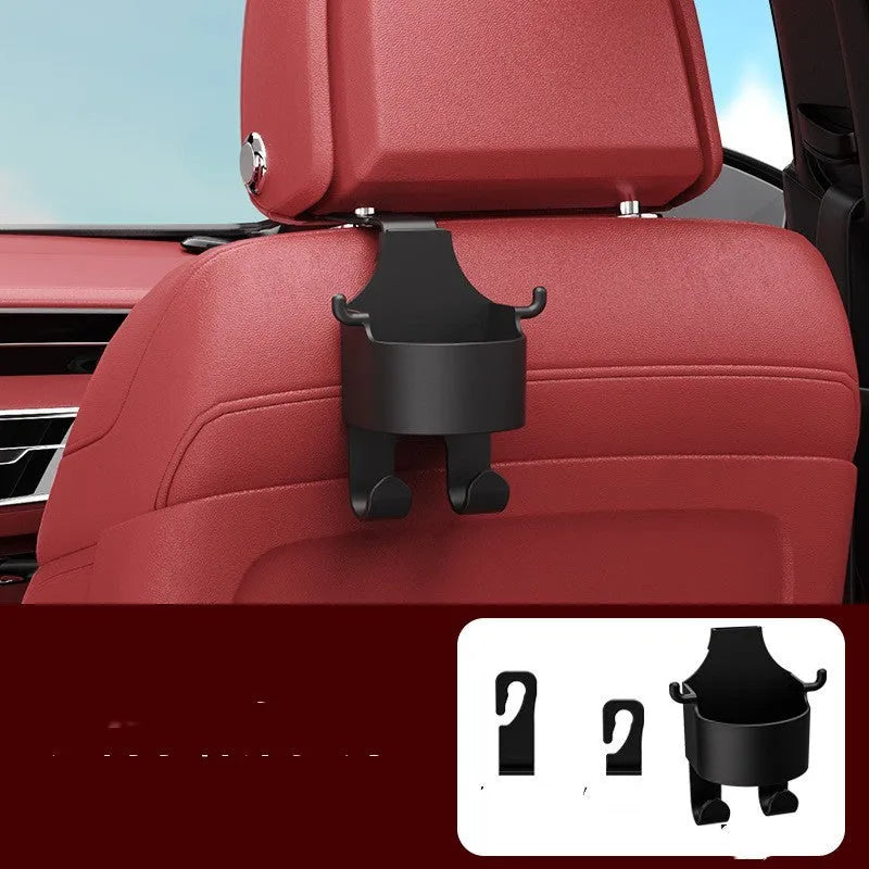 Black plastic car hook seat back organiser with cup holder and dual hooks mounted on headrest