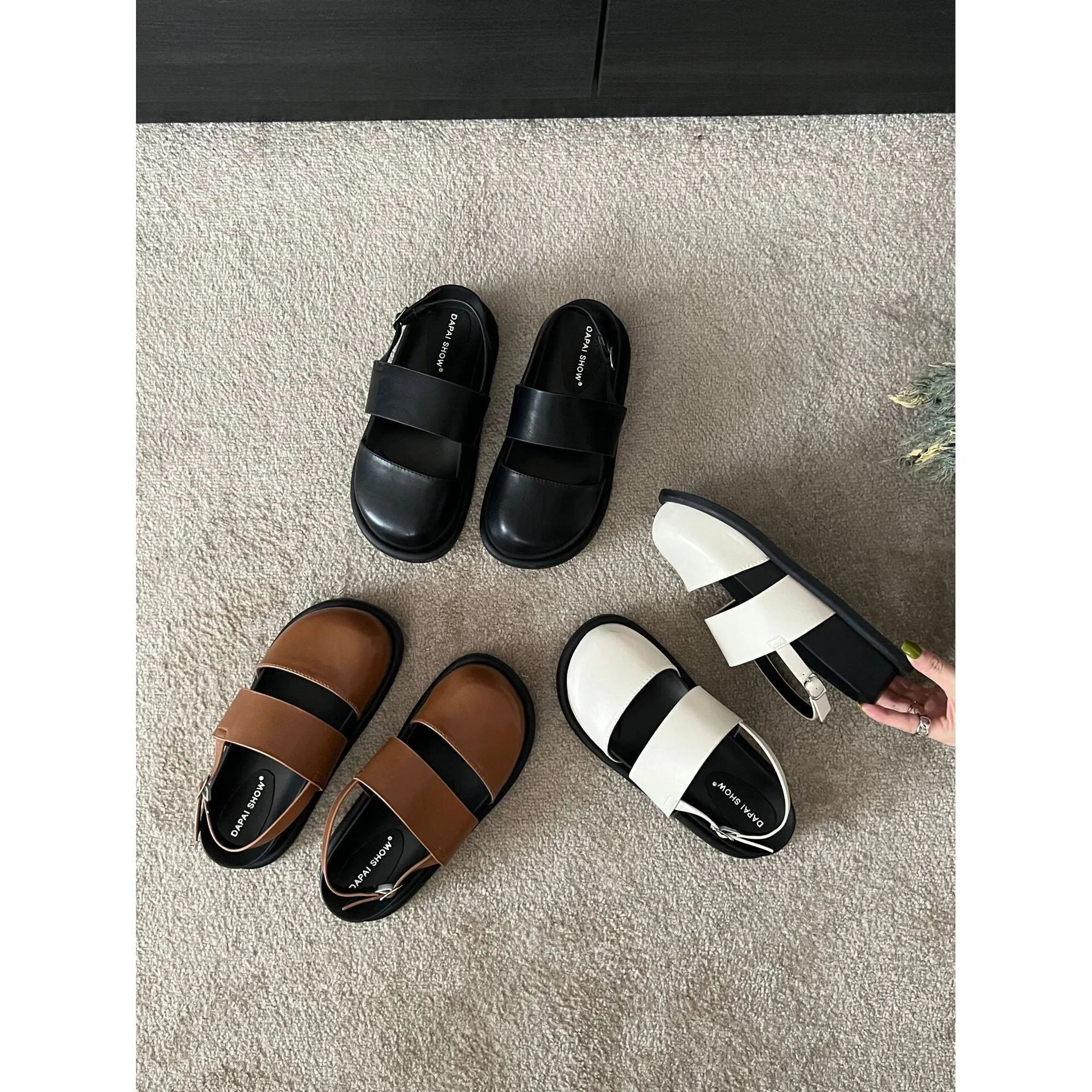 Retro women's sandals with a closed toe, ankle strap buckle, and platform sole in apricot colour.