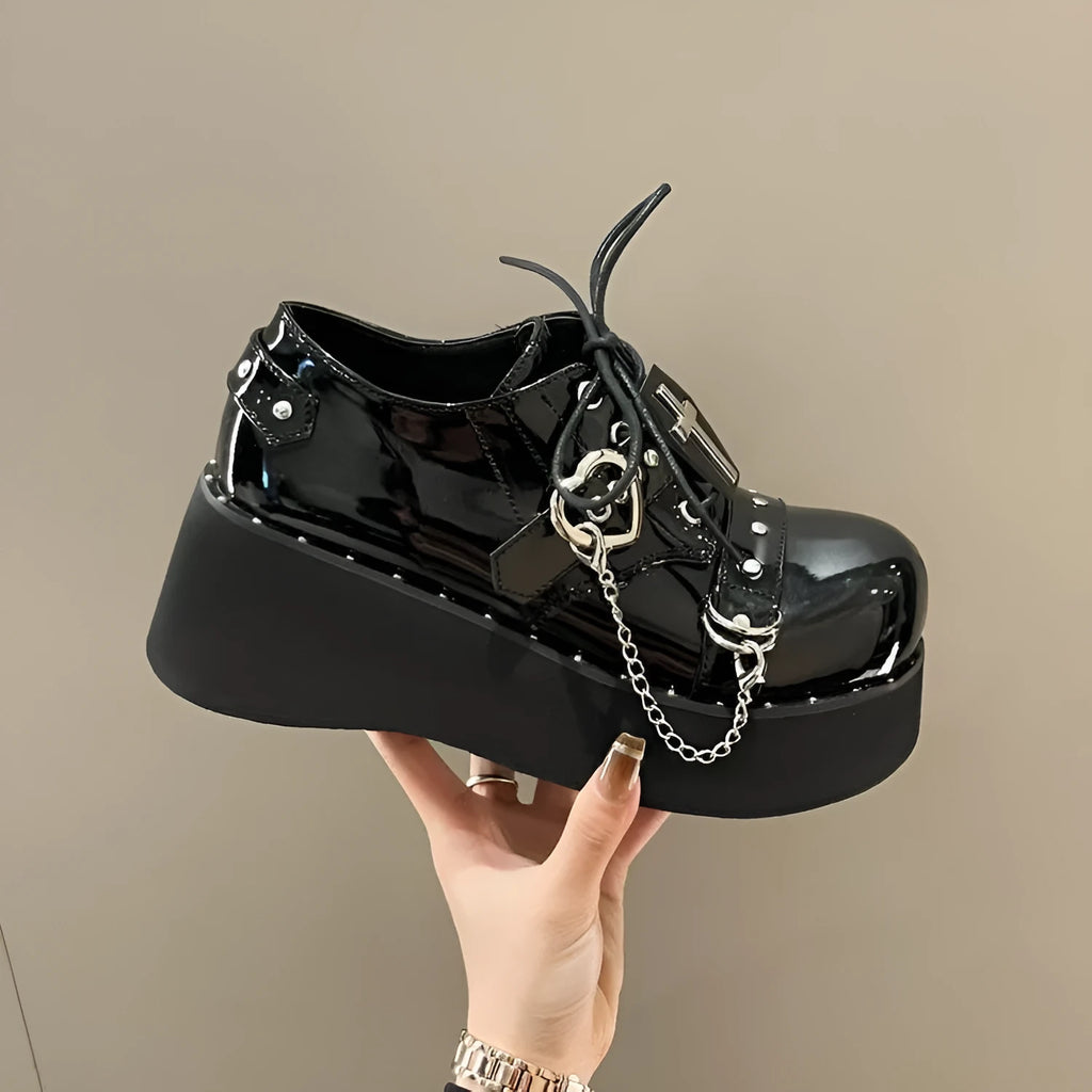 Black punk platform leather shoes with rubber sole and decorative stitching in dark lolita style
