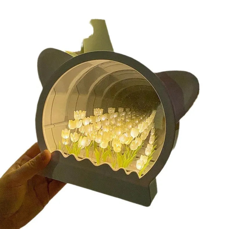 Handmade DIY cat head night lamp surrounded by colourful tulip flowers
