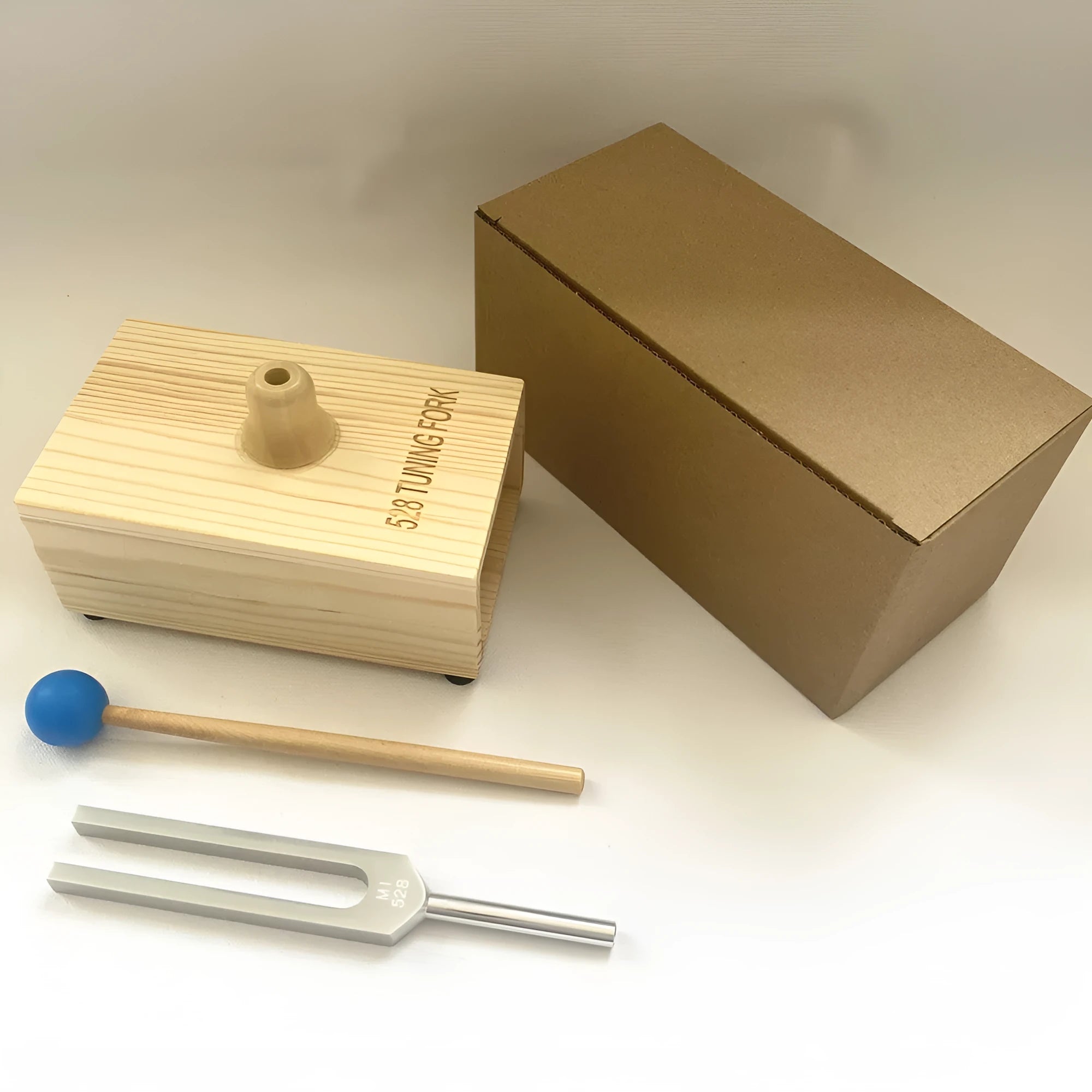Aluminium alloy 432Hz tuning fork and speaker set for sound therapy in a kraft paper box.
