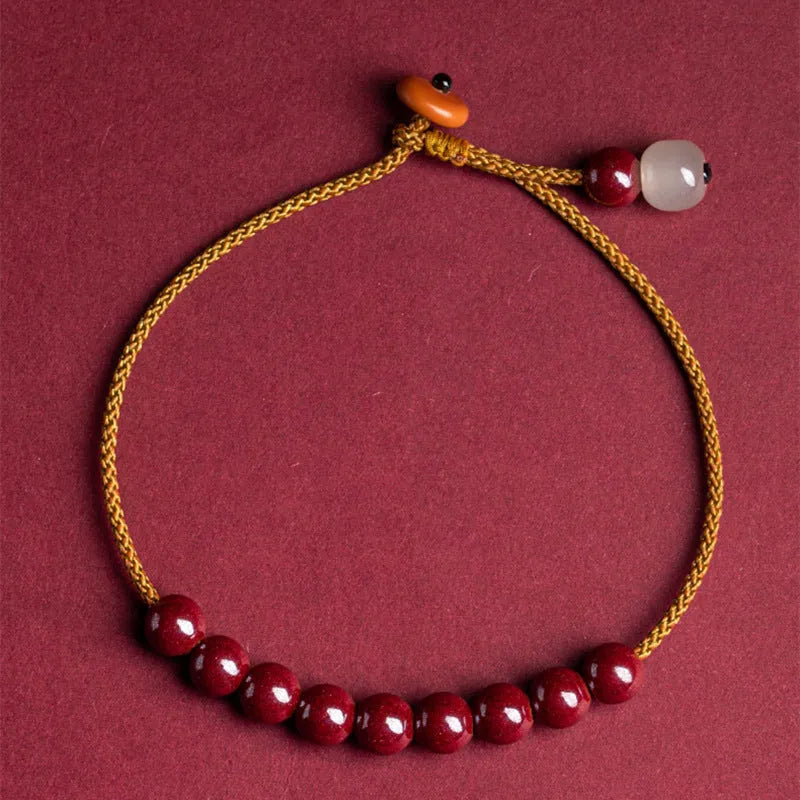 Hand-woven natural cinnabar bracelet with simple geometry shape on light background
