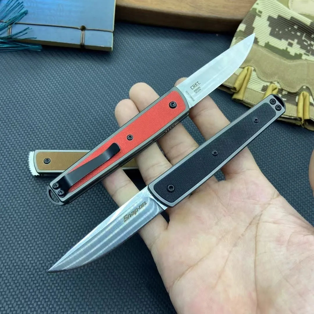 CRKT 7190 folding fruit knife showing black stainless steel blade and handle with dimensions displayed