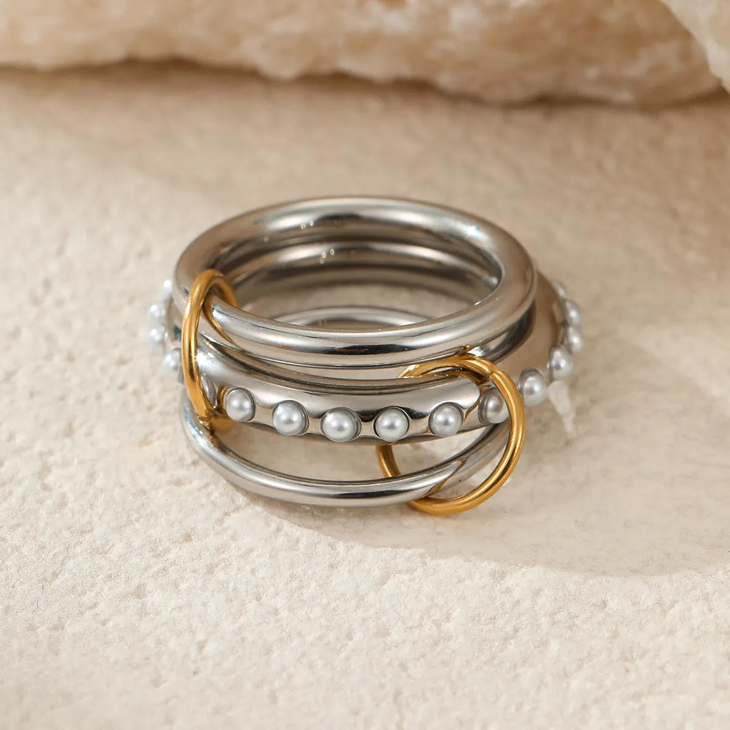 Stacked stainless steel rings with 18K gold plating in colour-matched set for women