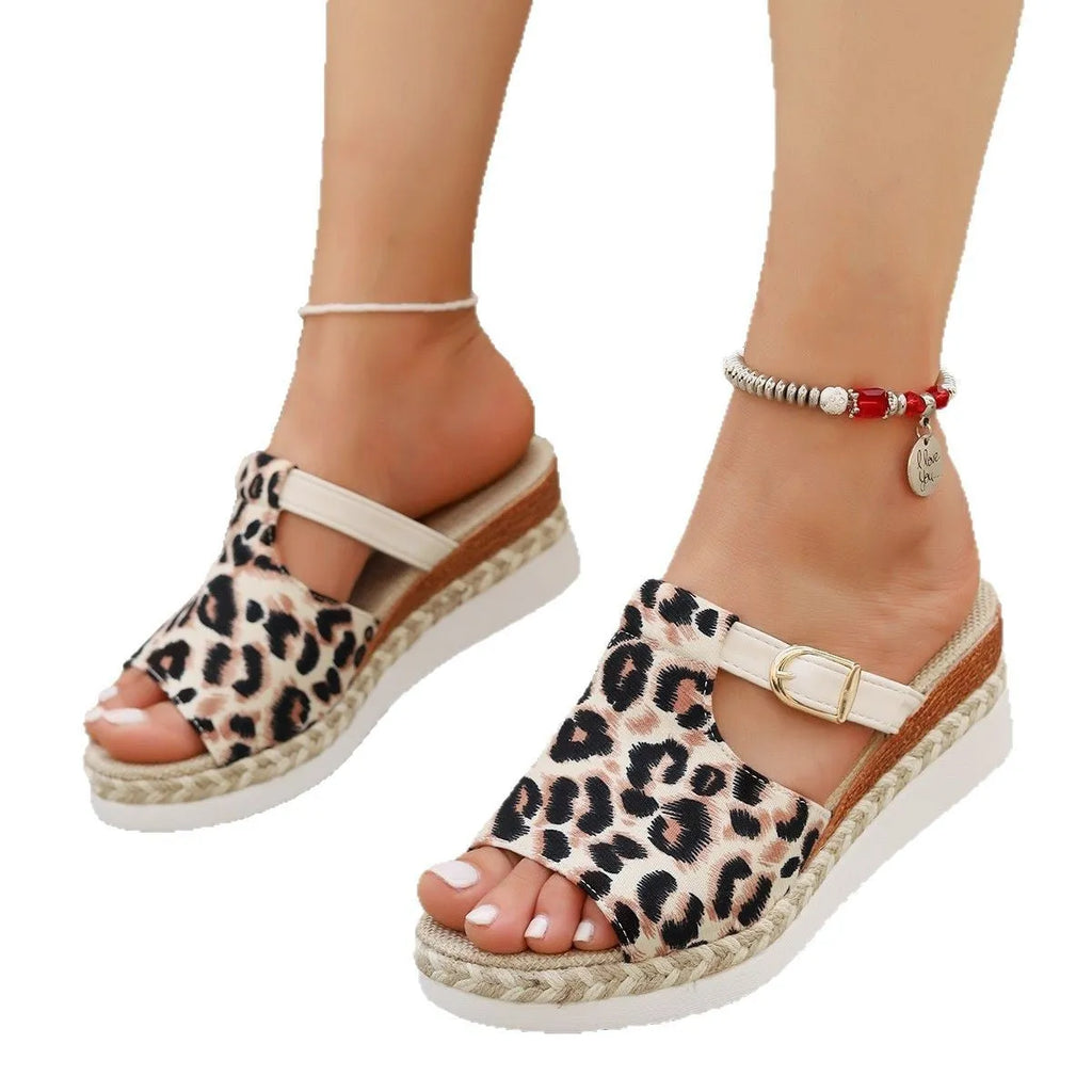 Beige leopard print wedge platform sandals with fish mouth toe opening on a white background.