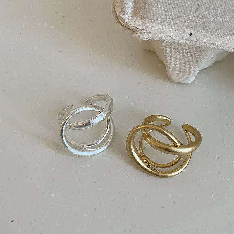 3D interlaced geometric open ring for women in matte metal with gold electroplating