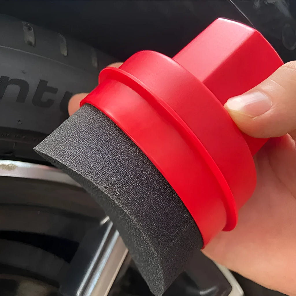 Black and red tyre polishing sponge brushes with PP handles and protective lids on a garage worktop
