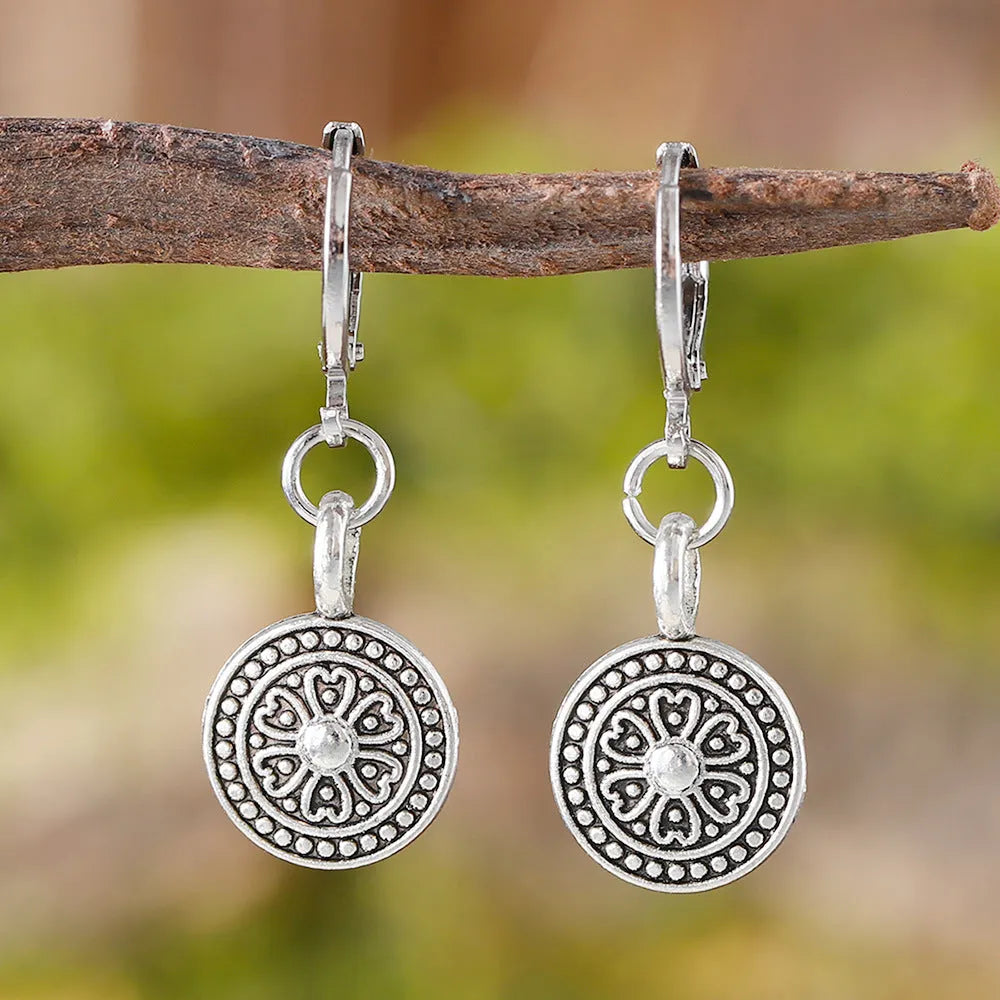 Bohemian style geometric round earrings with distressed ethnic print and retro electroplated finish