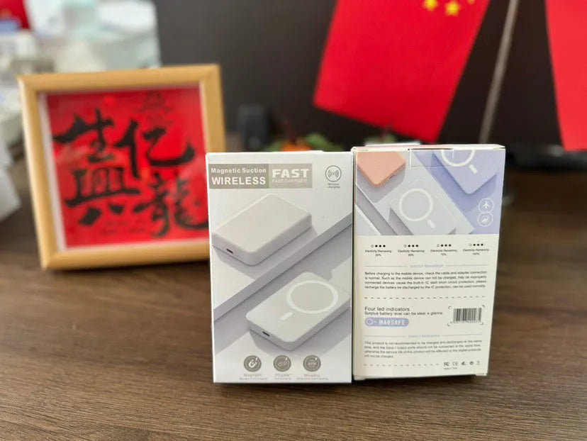 White portable magnetic wireless charger power bank showing compact design and charging surface