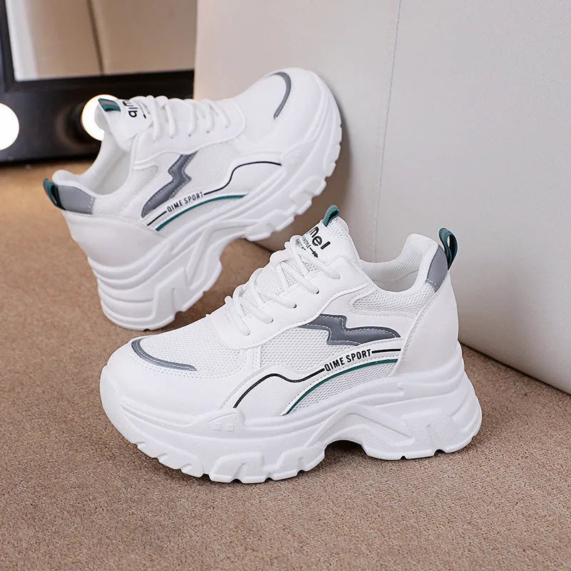 Women's white breathable dad shoes with cross straps and a height-increasing insole, shown with laces.