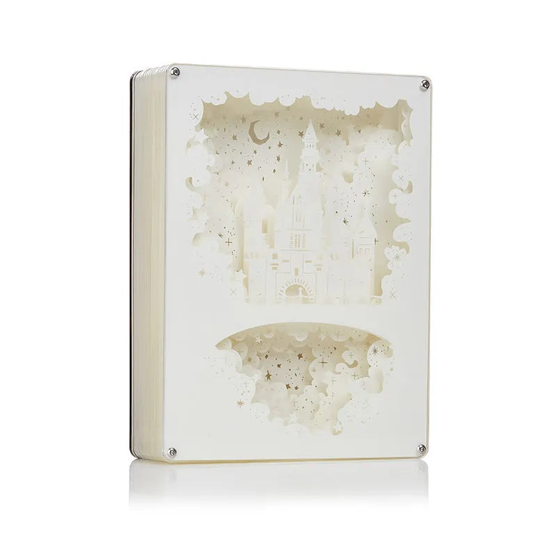 Modern bedside night light with paper carving design and remote control on wooden table